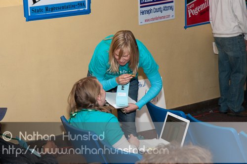 R. T. Rybak aide Erica Prosser consults with another campaign vo